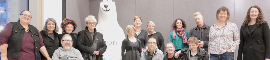 First official Australia and Berlin Arts Exchange Project tour photo of artists, carers, interpreters and management stand with the Berlin Bear in the foyer of the hotel Capri by Fraser in Berlin